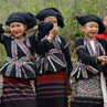 H'mong hill tribe ladies.  Known as Black Hmong because of the colour of their dress and the blackening of their front teeth using charcoal.