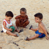 Children playing on the beach at Caravelas - Brazil.